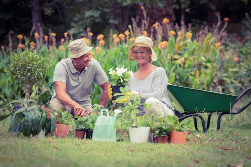 Gardener performing safe gardening with PPE in a residential garden